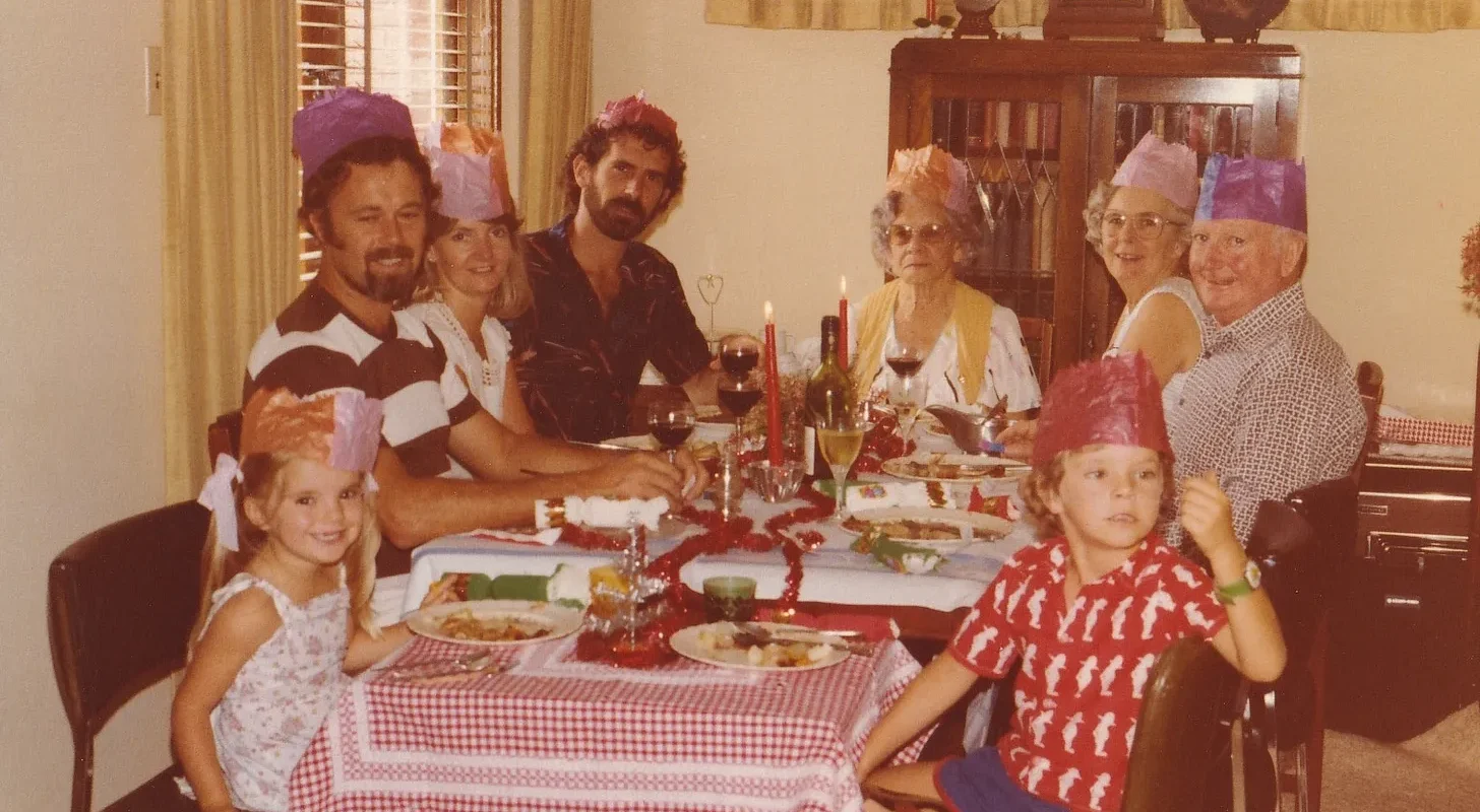 Family around table at christmas